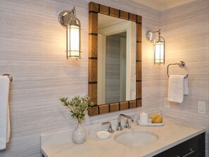 Designer toiletries, hair dryer, bathrobes, slippers