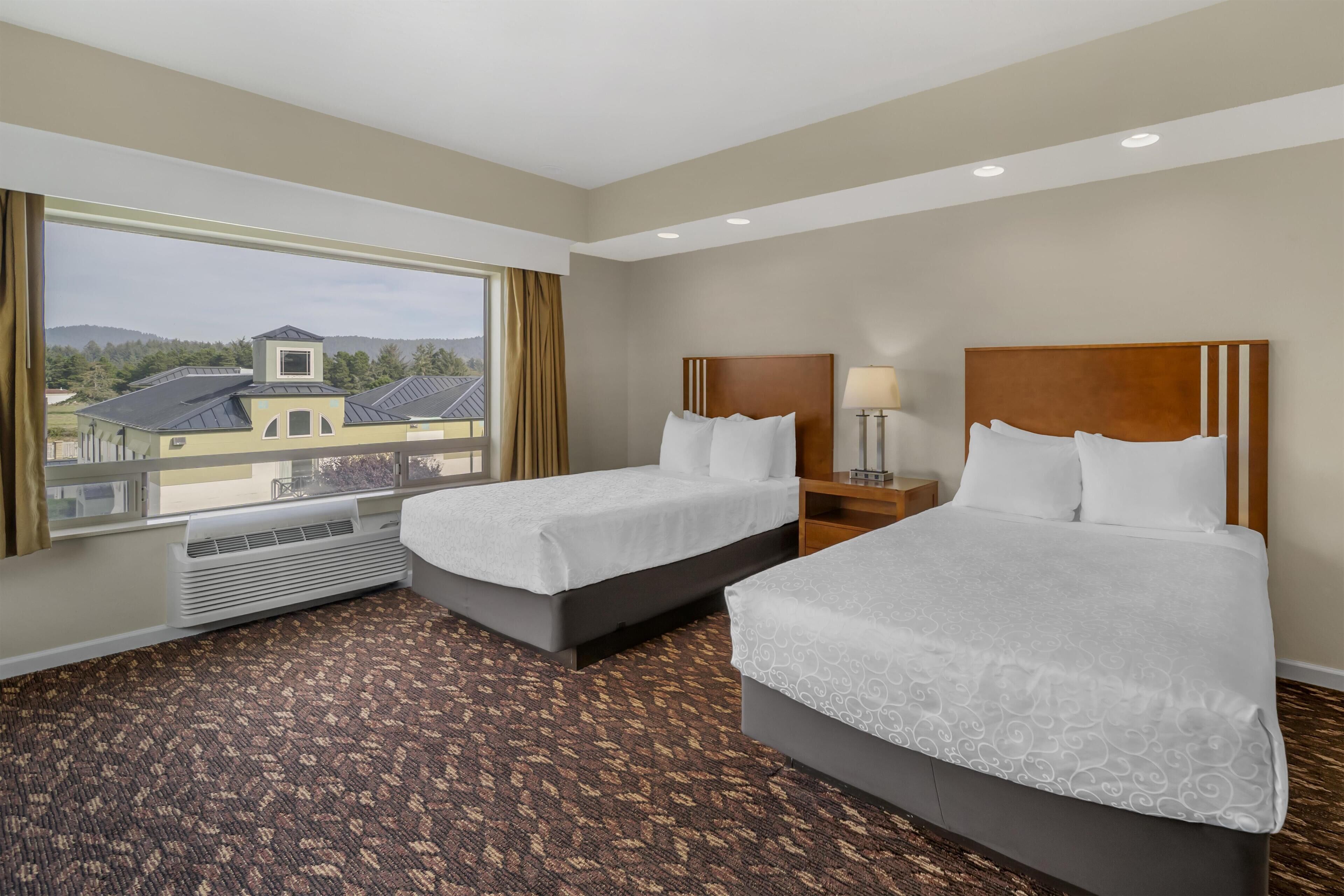 Standard Room, 2 Queen Beds, Non Smoking, City View | In-room safe, individually decorated, desk, laptop workspace