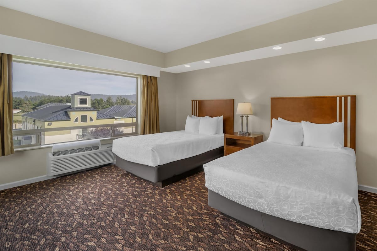 Standard Room, 2 Queen Beds, Non Smoking, City View | In-room safe, individually decorated, desk, laptop workspace