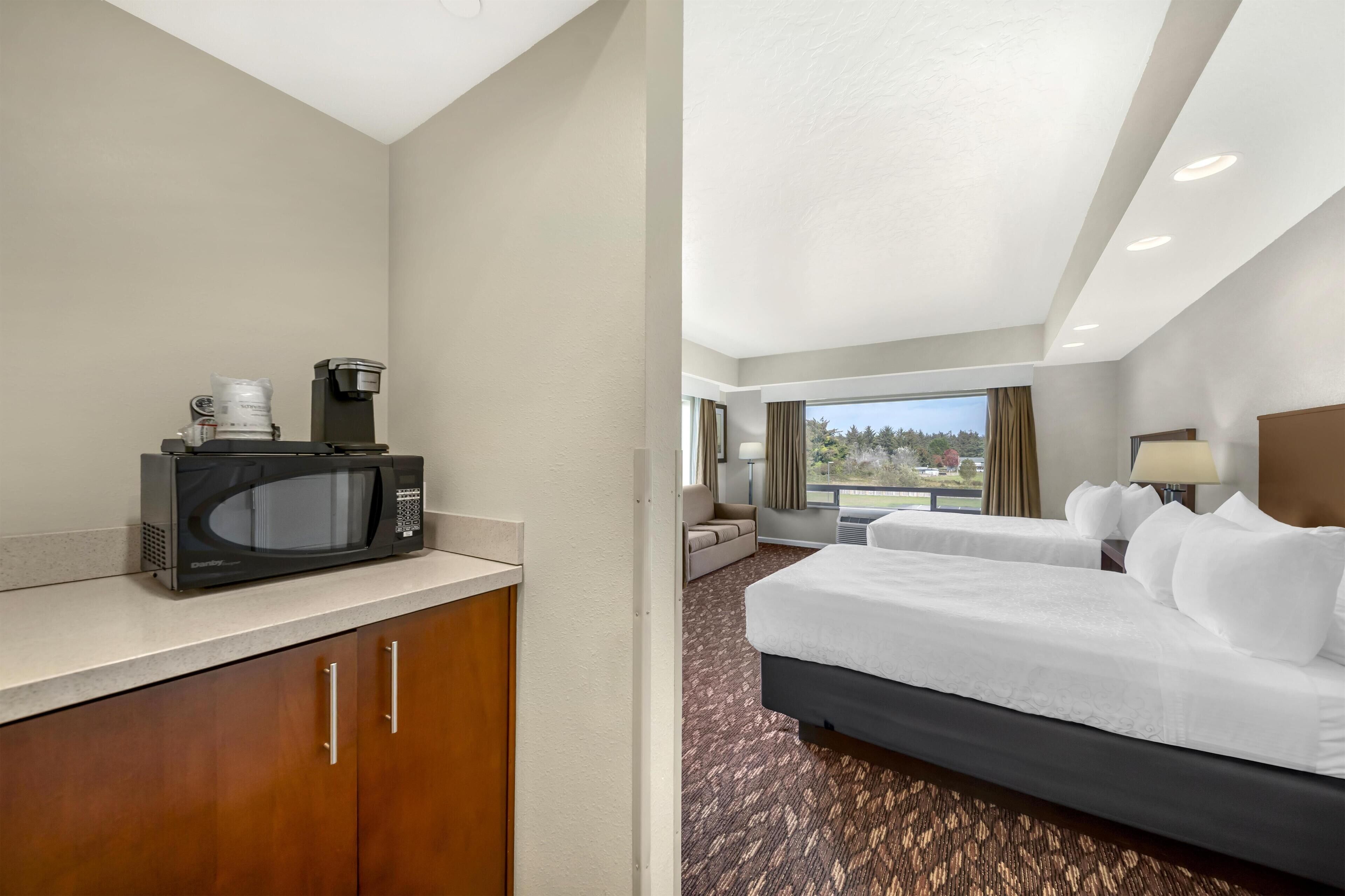 Standard Room, 2 Queen Beds, Non Smoking, City View | In-room safe, individually decorated, desk, laptop workspace