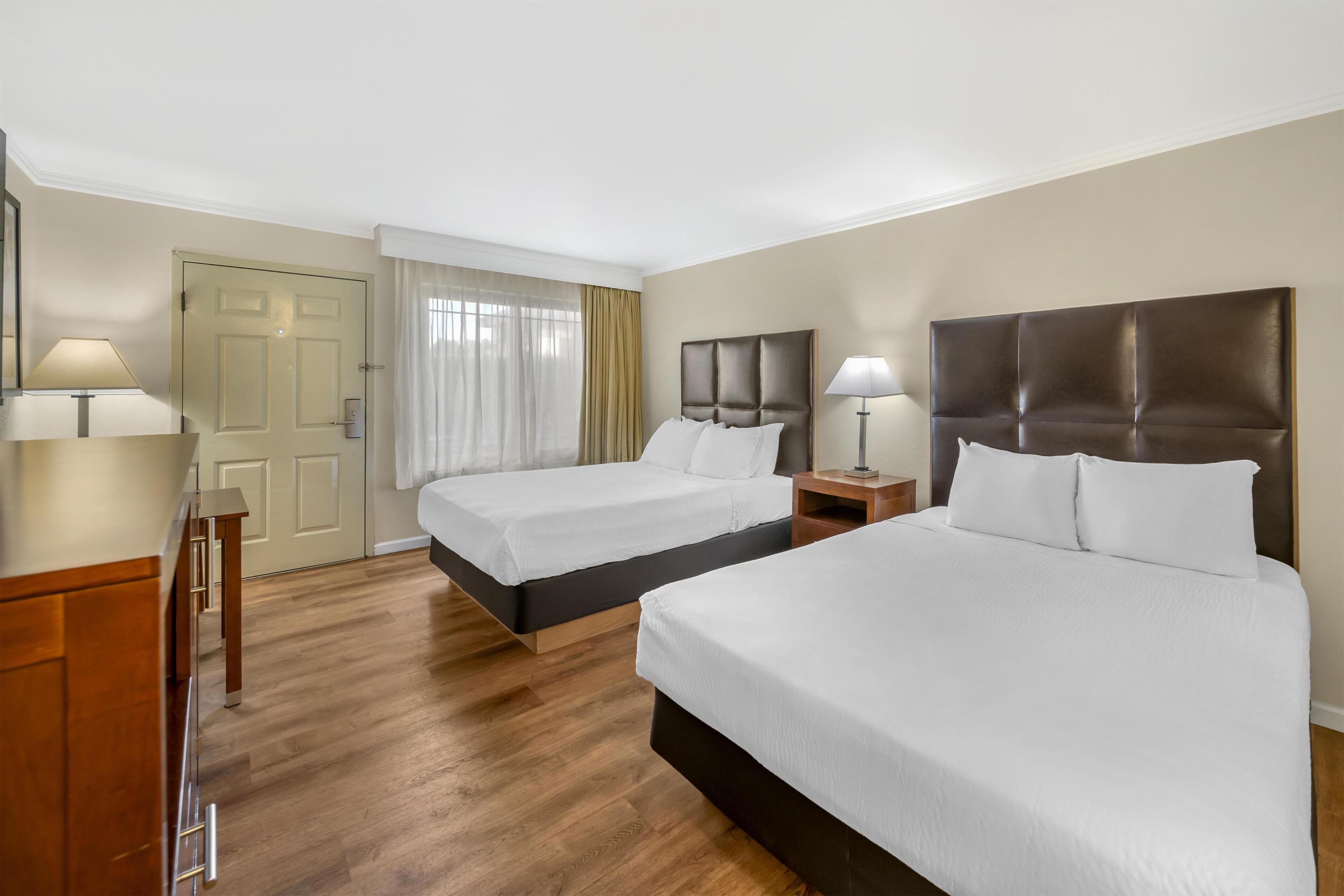 Standard Room, 2 Queen Beds, Non Smoking, Patio | In-room safe, individually decorated, desk, laptop workspace