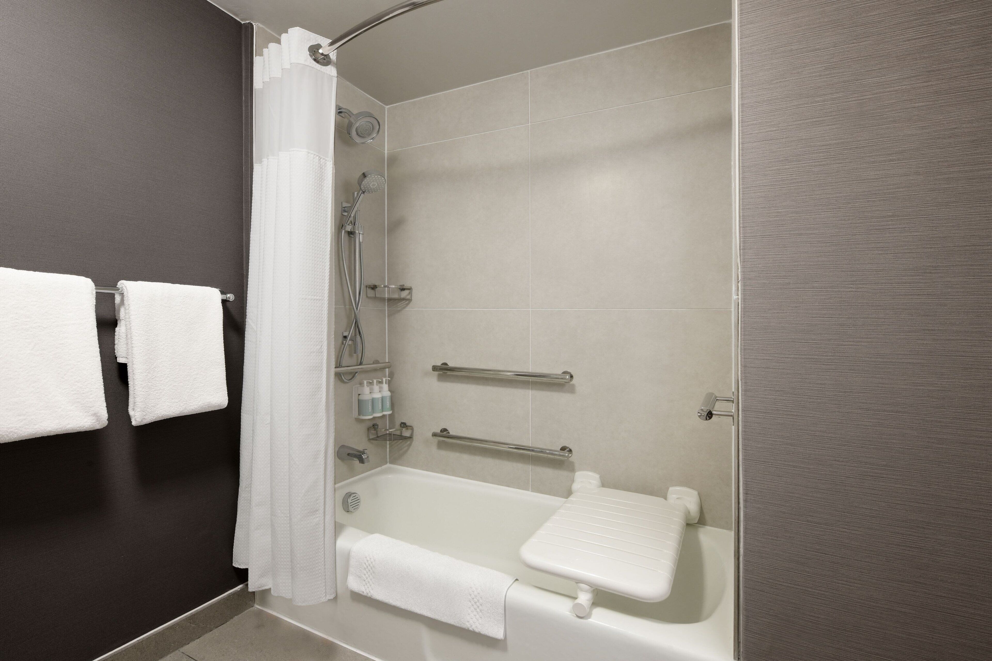 combined shower/bathtub, eco-friendly toiletries, hair dryer, towels