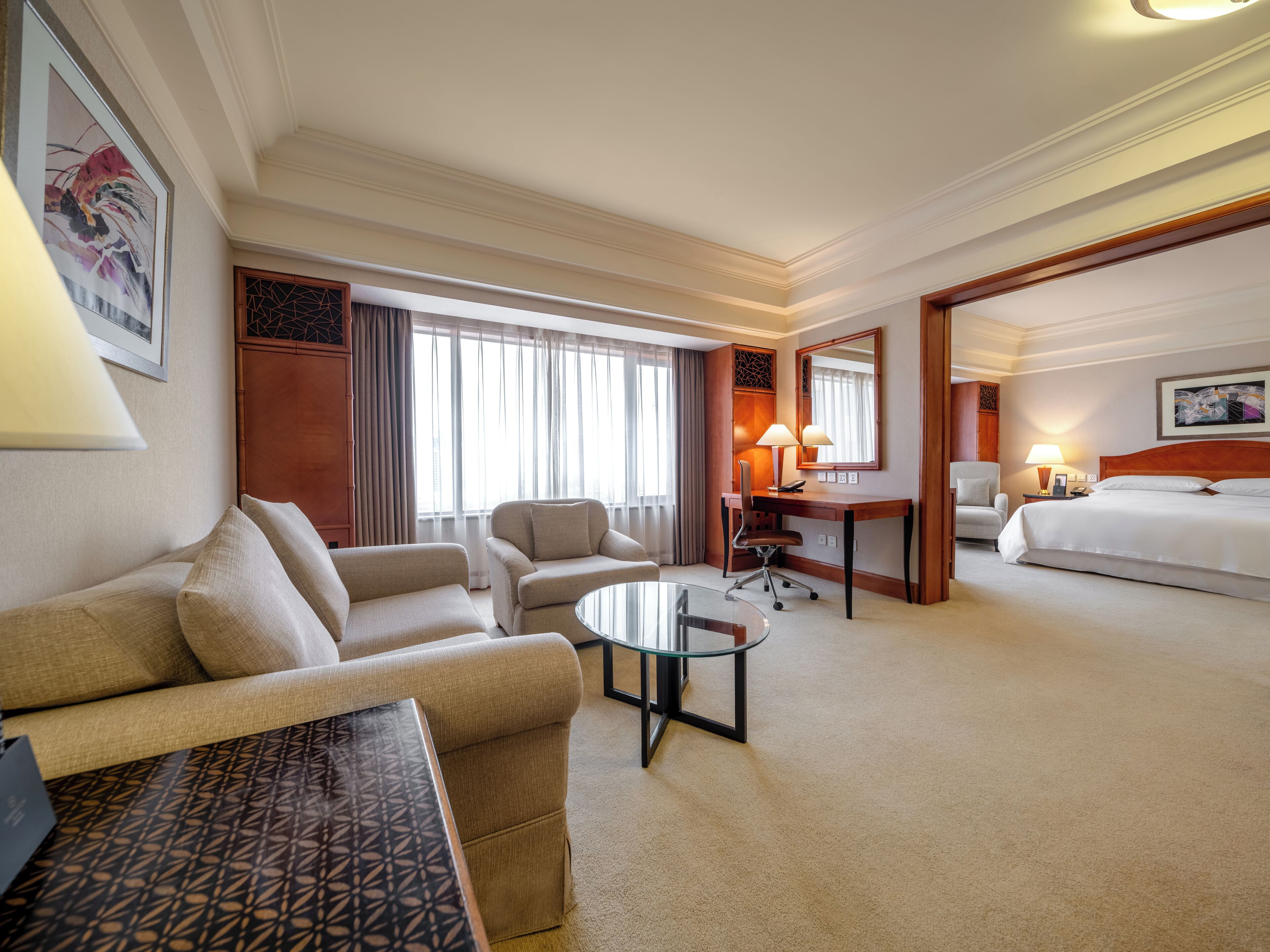 Deluxe Suite, 1 King Bed | Living area | 48-inch TV with satellite channels, iPod dock