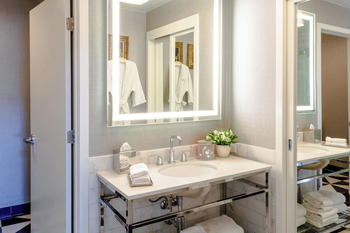 premier suite, 1 king bed, balcony | bathroom | designer toiletries, hair dryer, bathrobes, towels