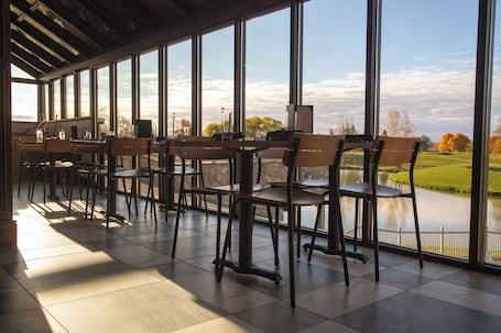 Breakfast, lunch, dinner served; golf course views