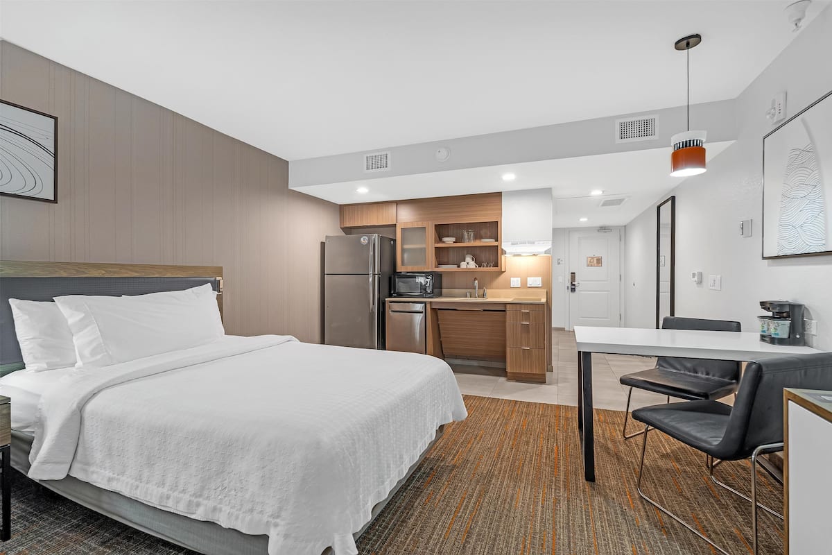 premium bedding, desk, laptop workspace, blackout curtains