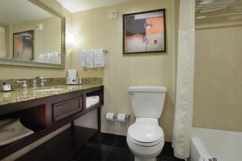 Combined shower/tub, designer toiletries, hair dryer, towels