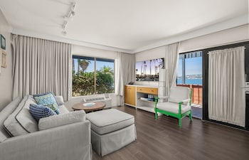 Suite, 1 King Bed (Bayside Bungalow Bay) | Living area | 60-inch LCD TV with cable channels, TV, table tennis at Paradise Point Resort & Spa