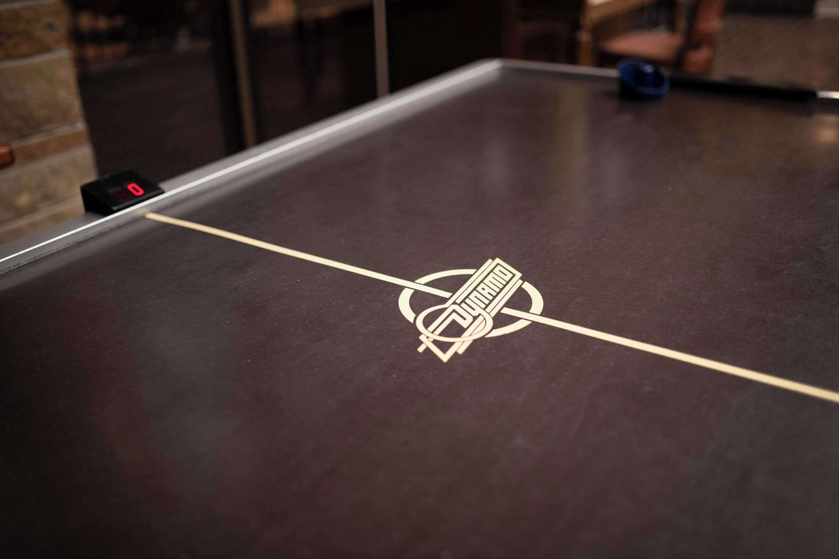 A table with a logo and a digital counter.