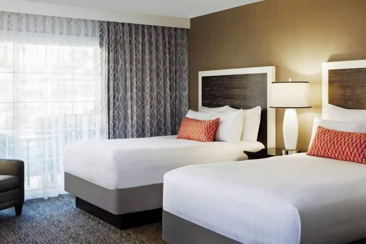 Hypo-allergenic bedding, down duvets, pillow-top beds, in-room safe