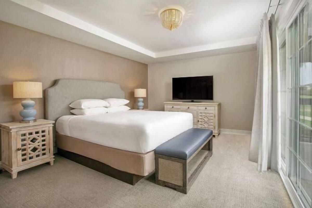 Hypo-allergenic bedding, down duvets, pillow-top beds, in-room safe