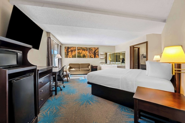 Suite, 1 King Bed, Refrigerator | Individually decorated, individually furnished, desk, iron/ironing board