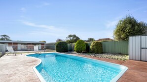A rectangular swimming pool with a curved edge, surrounded by a concrete deck. - Baronga Motor Inn (Colac)