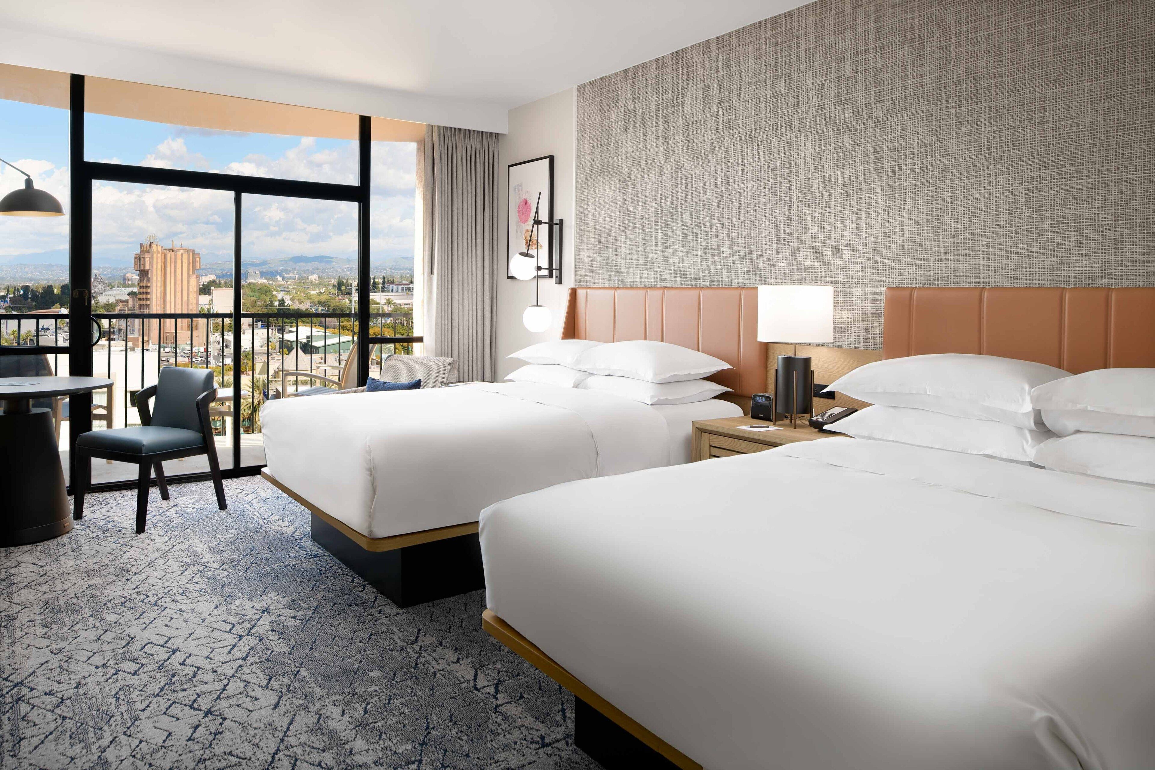 premium room, 2 queen beds | premium bedding, in-room safe, desk, laptop workspace