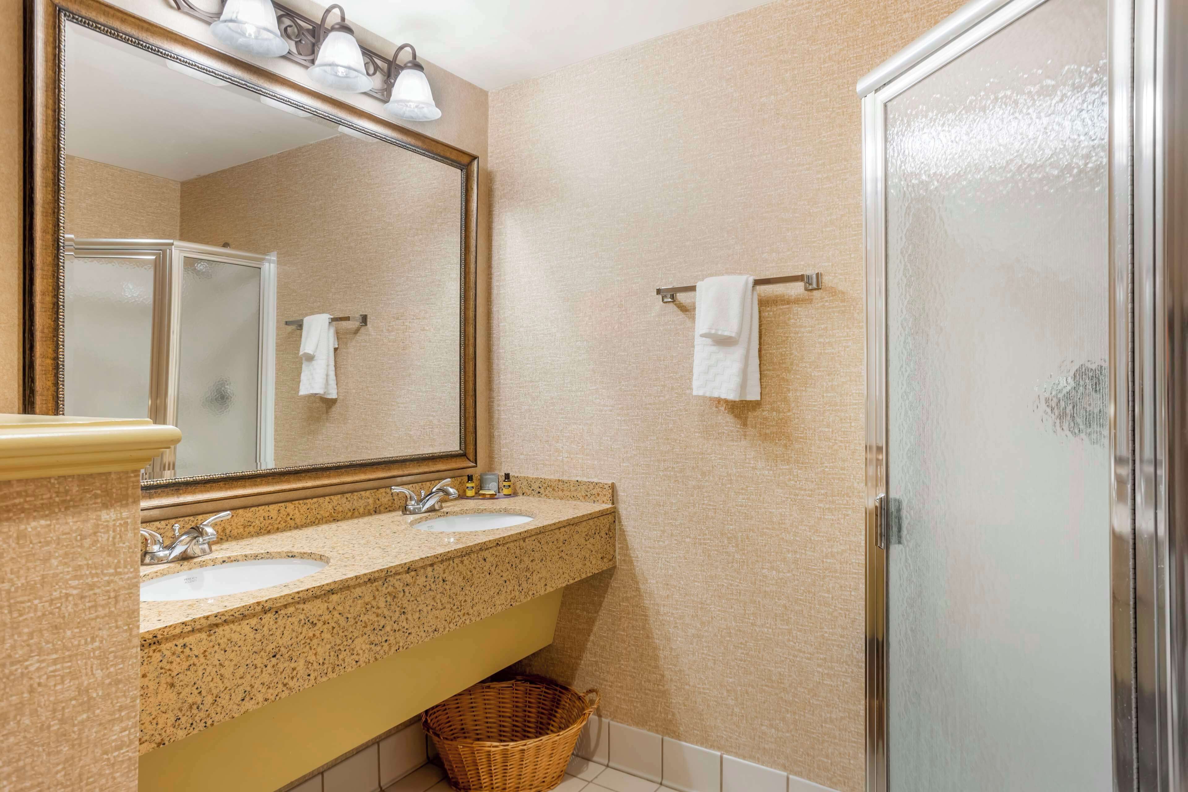 suite, multiple beds, non smoking, jetted tub (living room) | bathroom | combined shower/bathtub, free toiletries, hair dryer, towels
