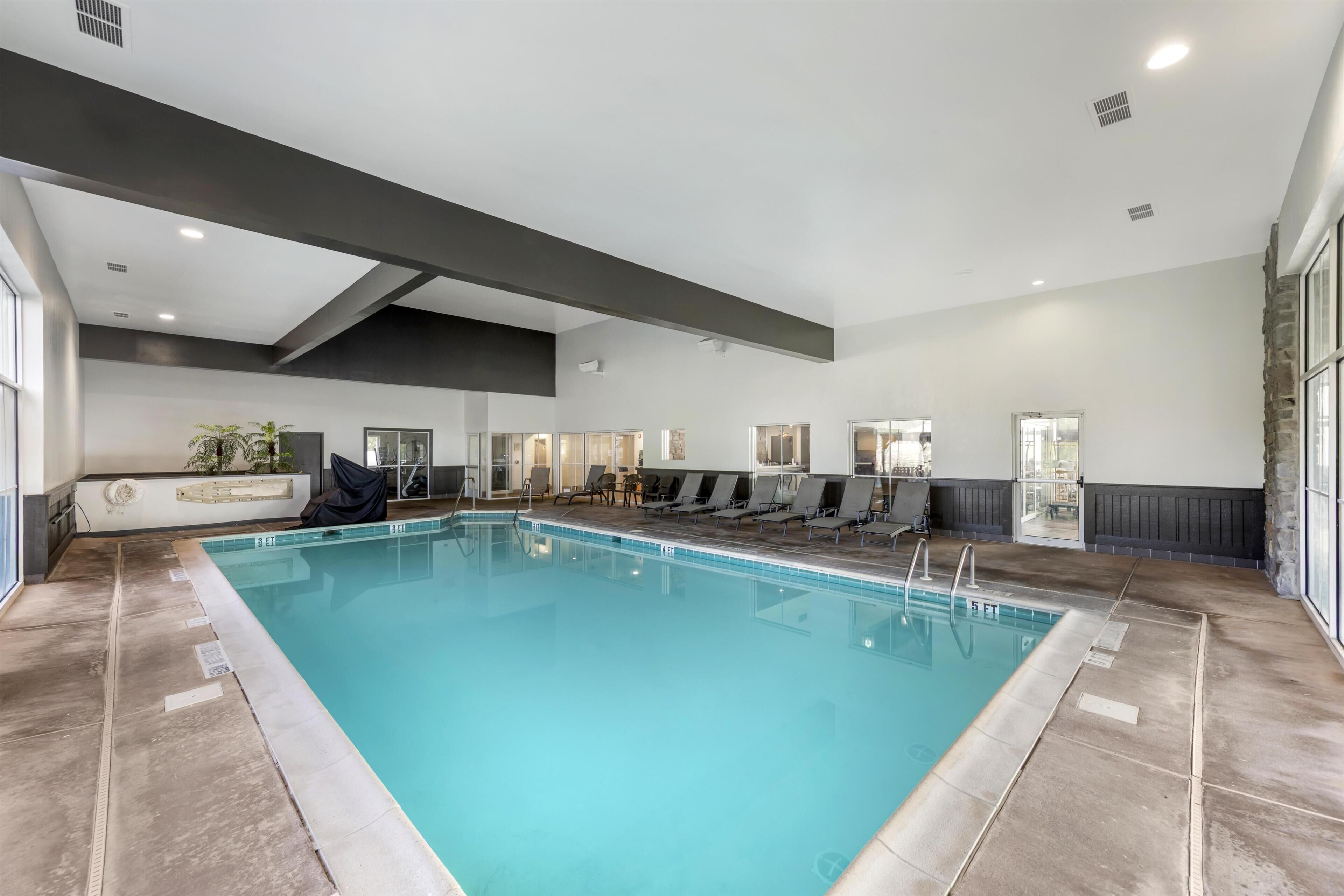 Indoor pool, seasonal outdoor pool, pool umbrellas, pool loungers