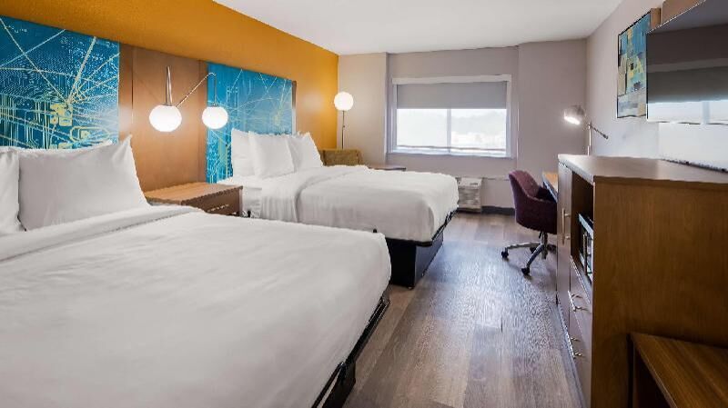 Premium bedding, pillowtop beds, desk, laptop workspace