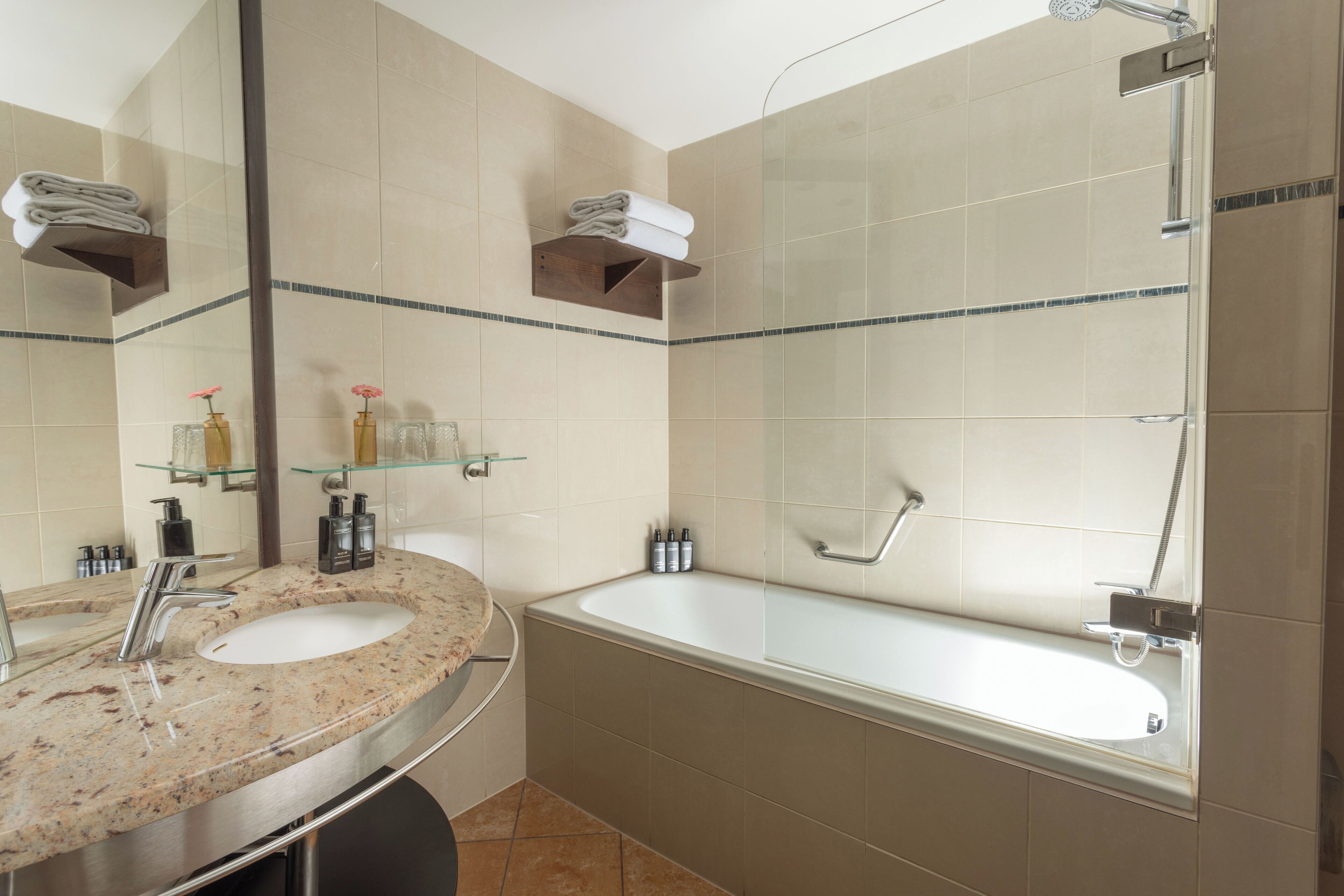 bathtub, hair dryer, bathrobes, slippers