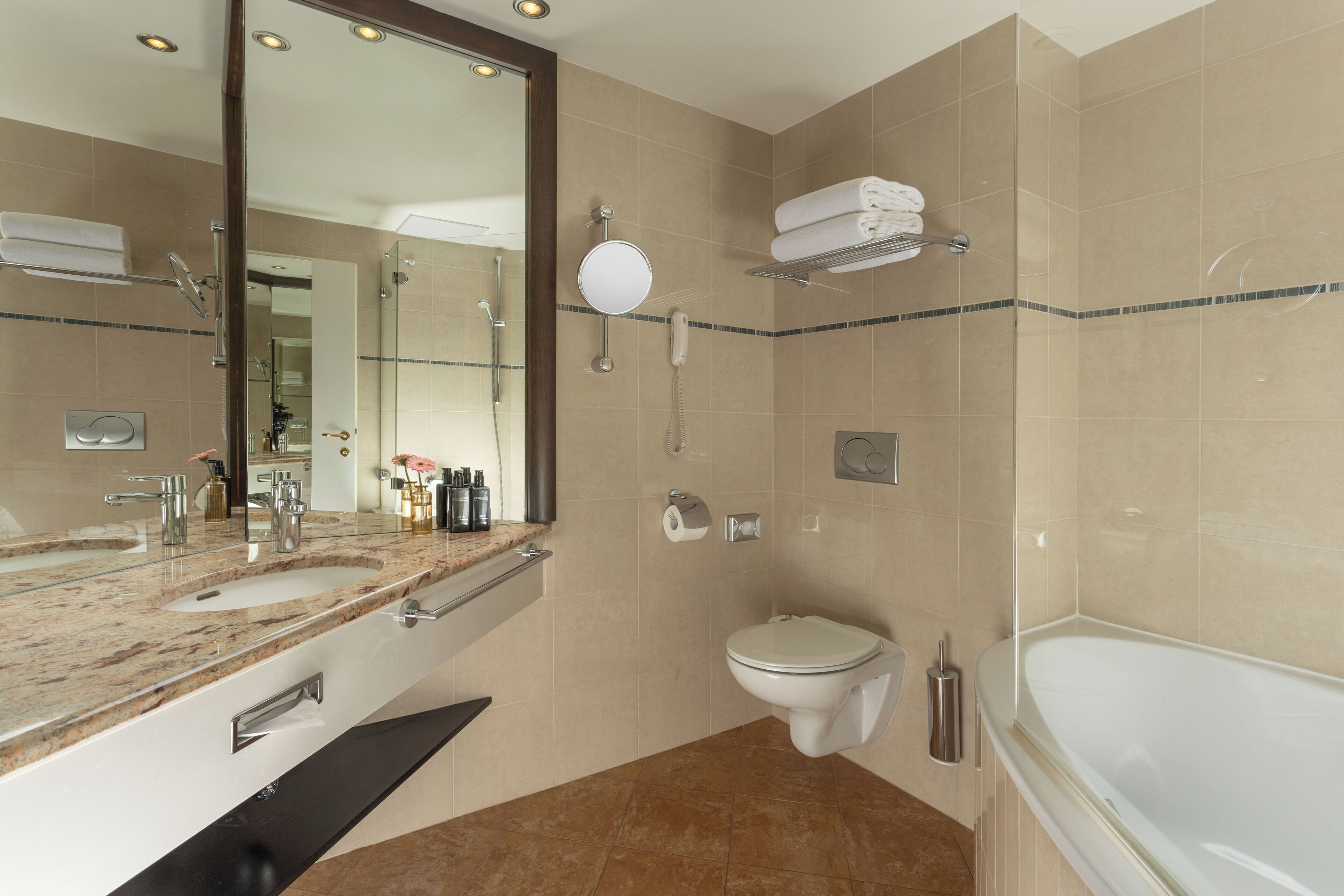 bathtub, hair dryer, bathrobes, slippers