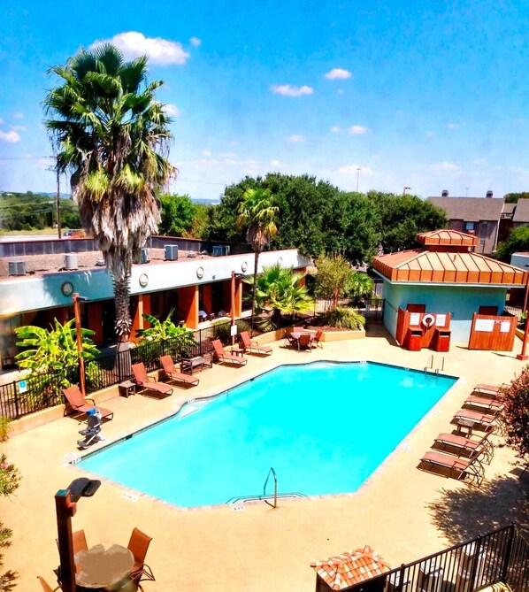 Outdoor pool, open 9:00 AM to 11:00 PM, pool umbrellas, sun loungers