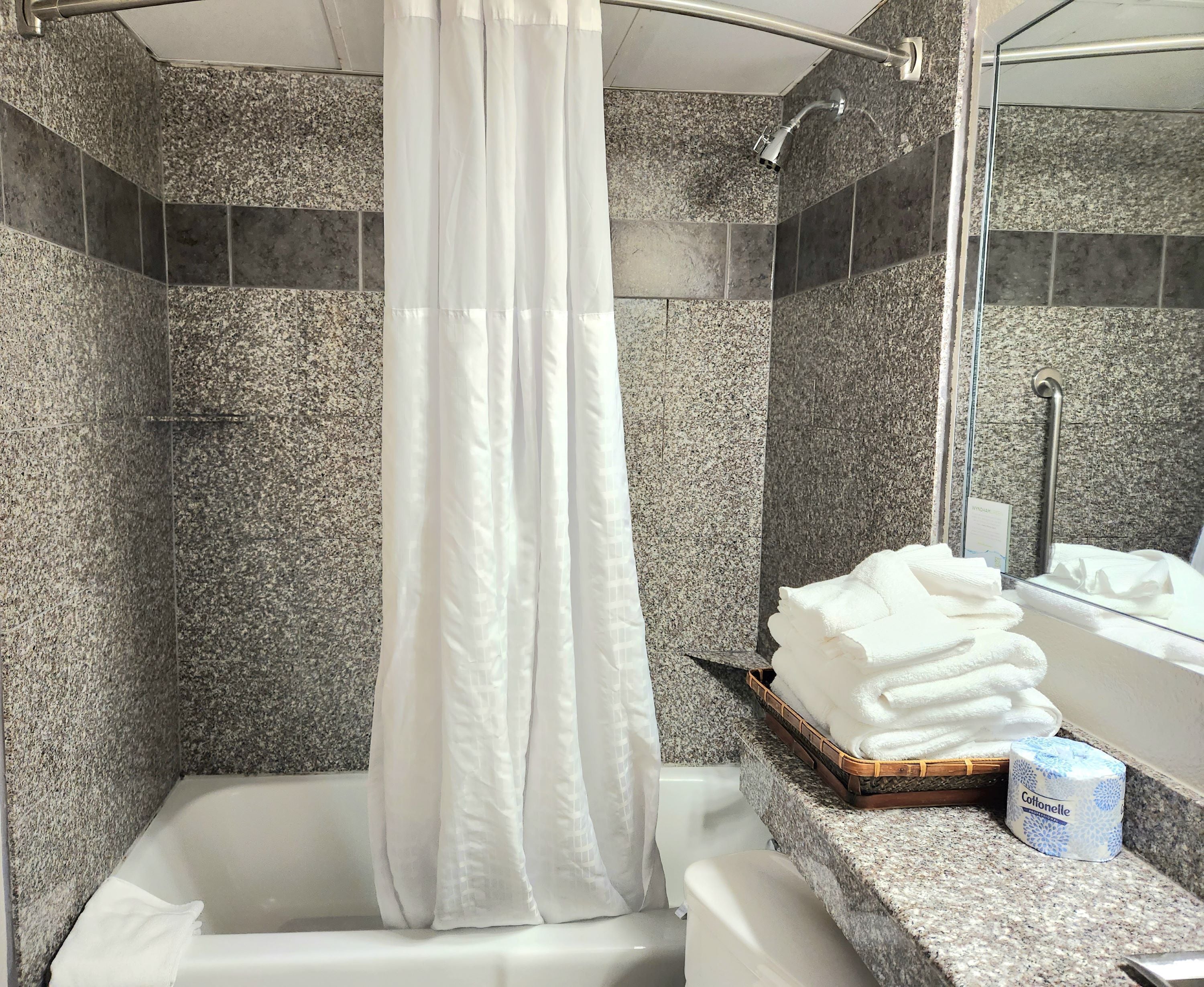 combined shower/bathtub, eco-friendly toiletries, hair dryer, towels