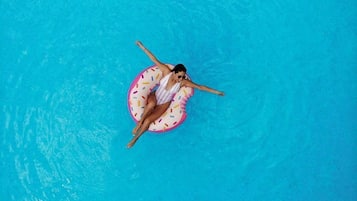 Outdoor pool, open 9:00 AM to 11:00 PM, pool umbrellas, pool loungers