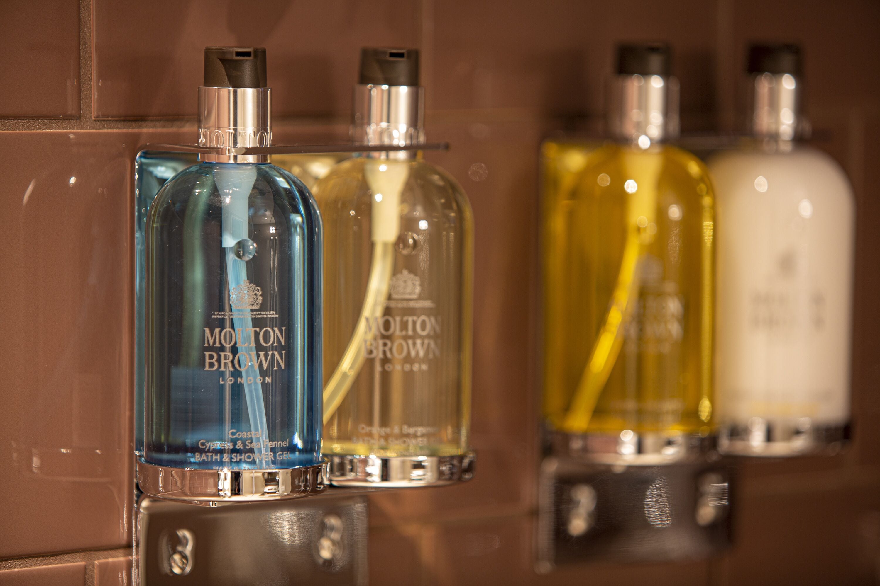 rainfall showerhead, designer toiletries, hair dryer, towels