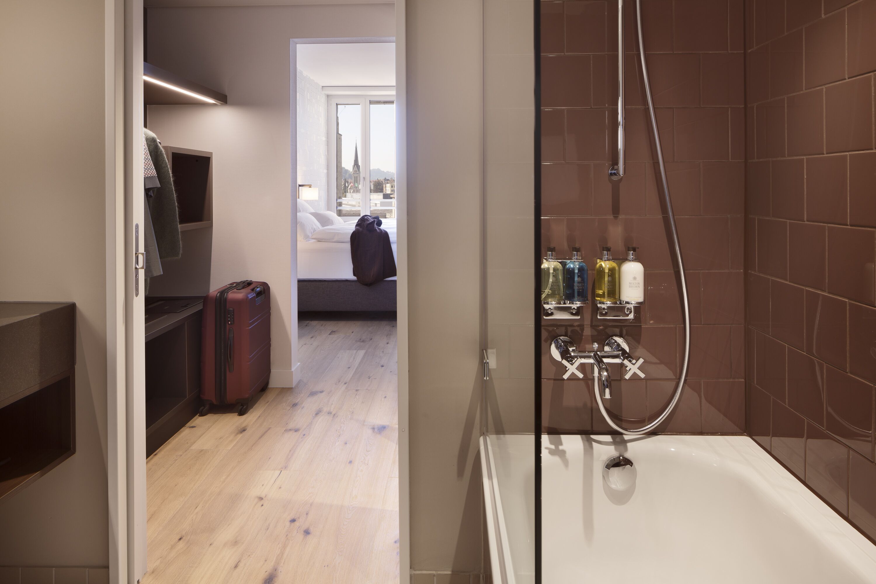 rainfall showerhead, designer toiletries, hair dryer, towels