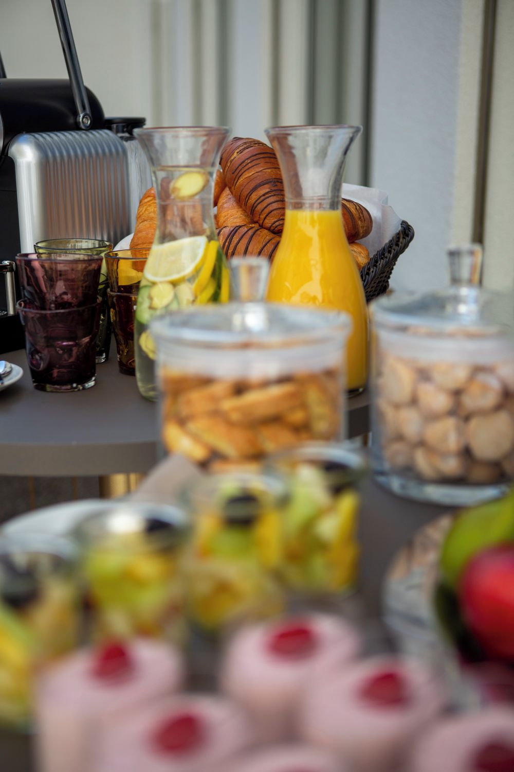 A breakfast buffet with various food items and beverages.