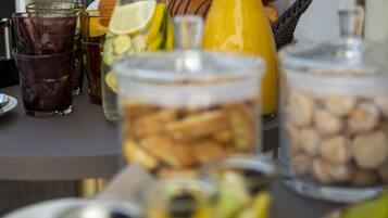 A breakfast buffet with various food items and beverages.