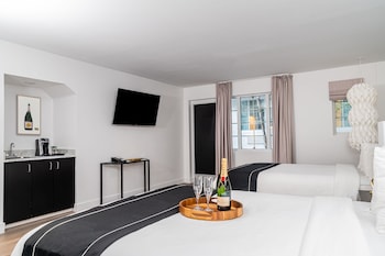 Signature Suite, 2 Queen Beds, Garden View | In-room safe, soundproofing, iron/ironing board, WiFi at Essex House By Clevelander