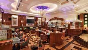 A luxurious lobby with a bar area, seating arrangements, and a large chandelier. - ITC Maurya, a Luxury Collection Hotel, New Delhi (New Delhi)
