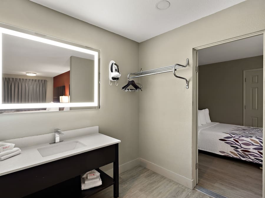 Deluxe Room (3 Queen Beds, Smoke Free) | Desk, blackout drapes, iron/ironing board, free cribs/infant beds