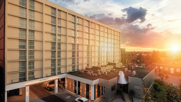 A modern hotel with a flat facade, multiple windows, and a rooftop terrace. - Holiday Inn Leicester by IHG (Leicester)
