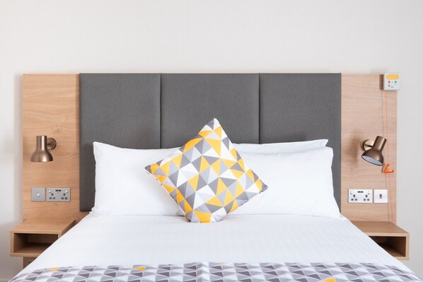 Hypo-allergenic bedding, desk, laptop workspace, blackout curtains