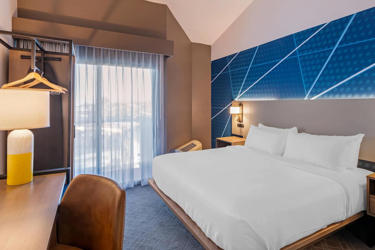 Suite, 1 King Bed with Sofa Bed, Balcony | Blackout drapes, iron/ironing board, free cribs/infant beds, free WiFi