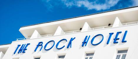 A building with the sign "The Rock Hotel" indicating a hotel establishment.