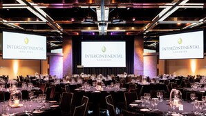 A conference room with multiple tables set for a formal event, featuring Intercontinental Adelaide branding. - InterContinental Adelaide by IHG (Adelaide)