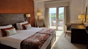 Hypo-allergenic bedding, desk, laptop workspace, blackout curtains