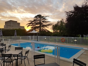 Seasonal outdoor pool, open 10:00 AM to 8:00 PM, pool loungers