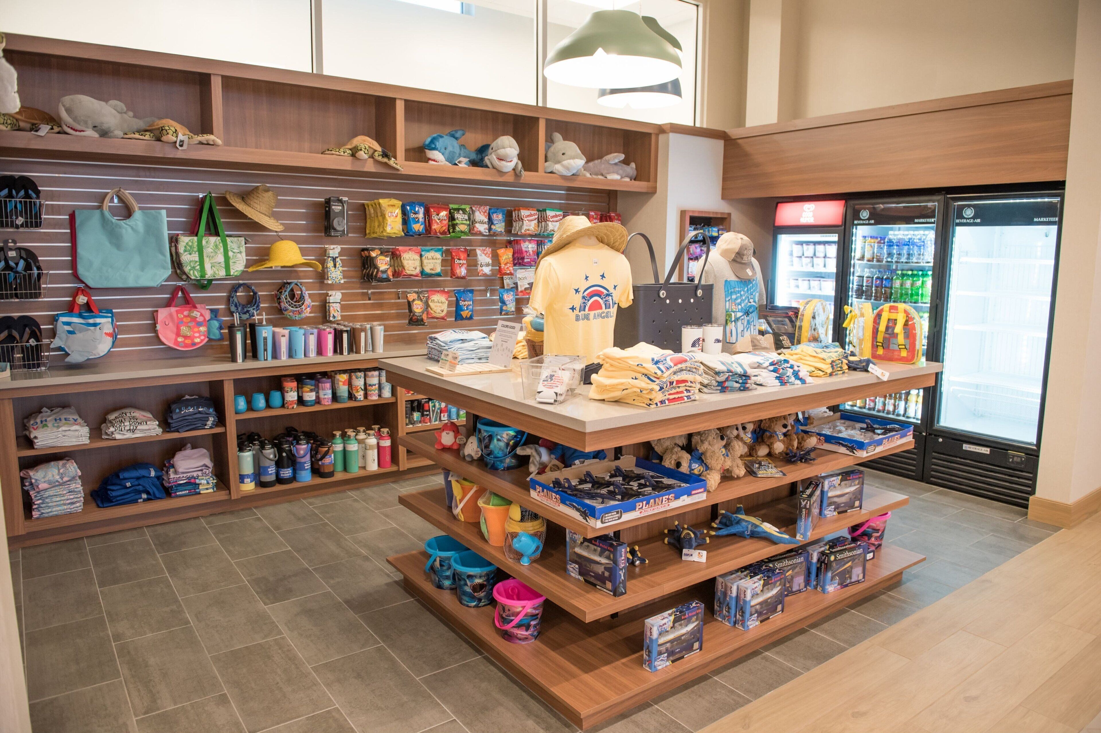 A retail store with shelves stocked with toys, bags, and other items.