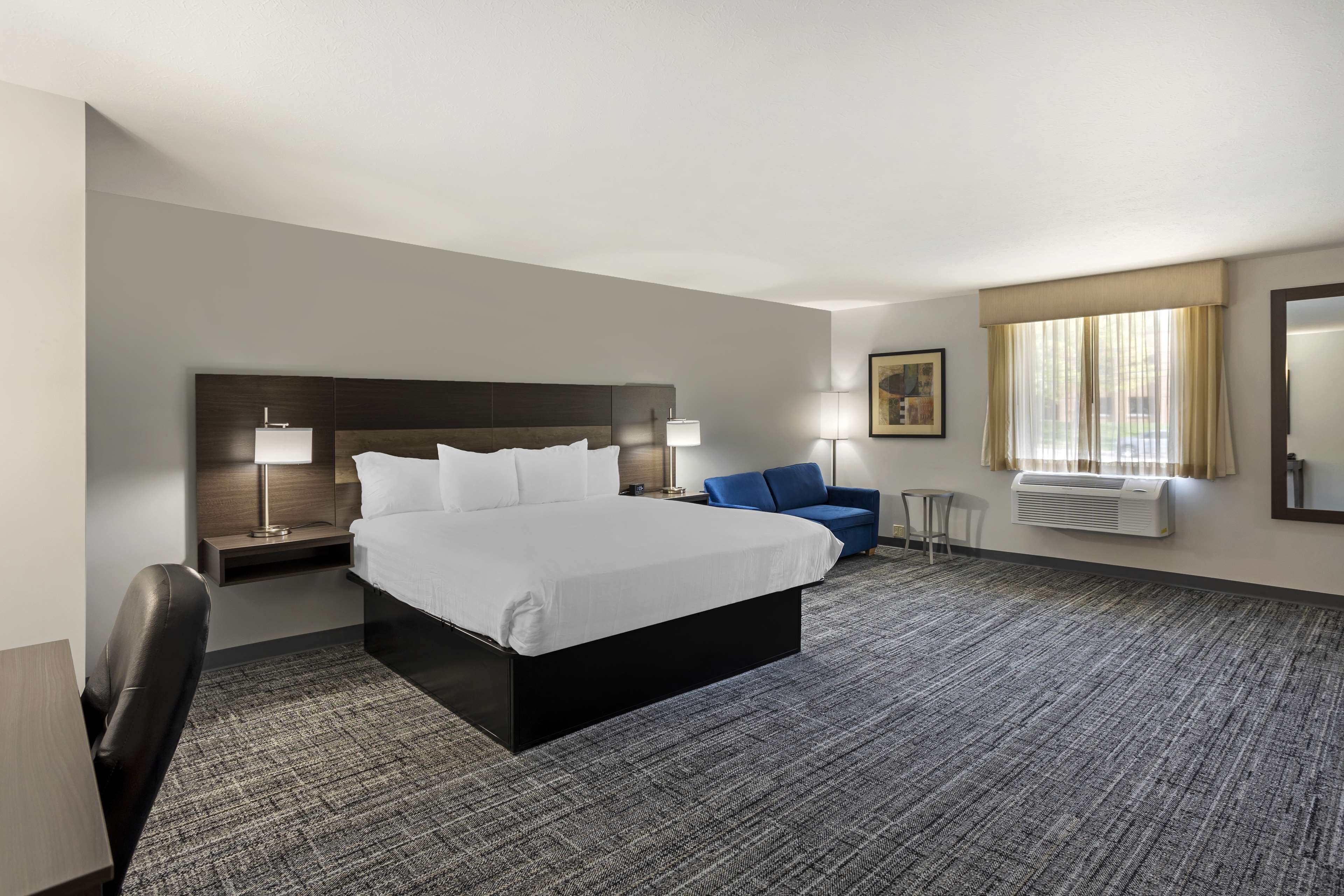 Pillow-top beds, laptop workspace, blackout curtains, iron/ironing board