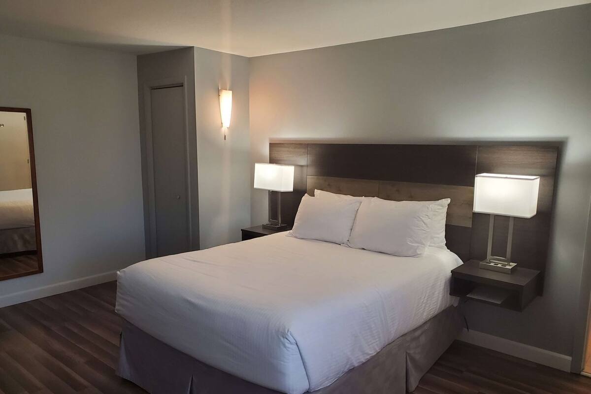 Pillow-top beds, laptop workspace, blackout curtains, iron/ironing board