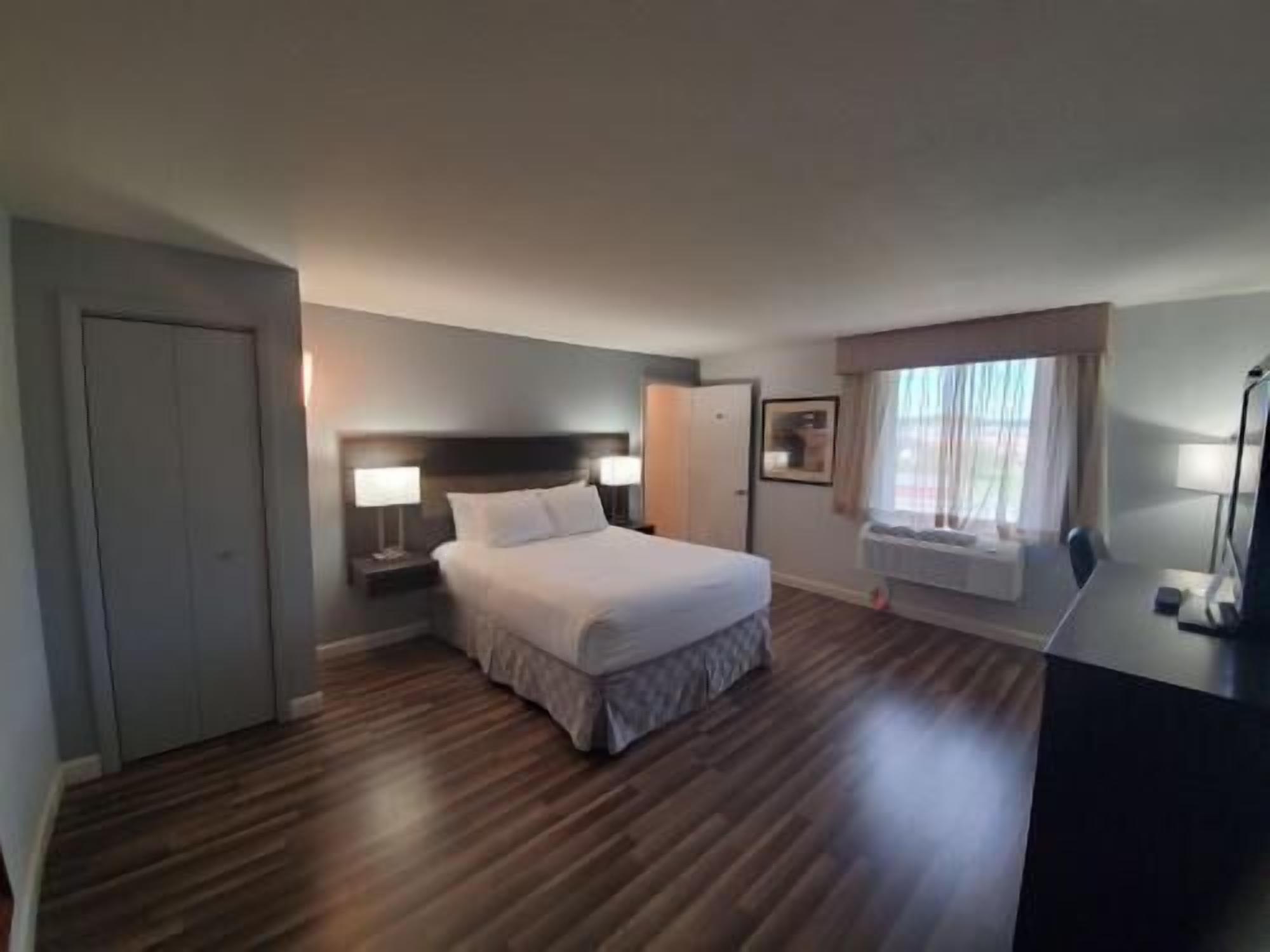 Pillow-top beds, laptop workspace, blackout curtains, iron/ironing board