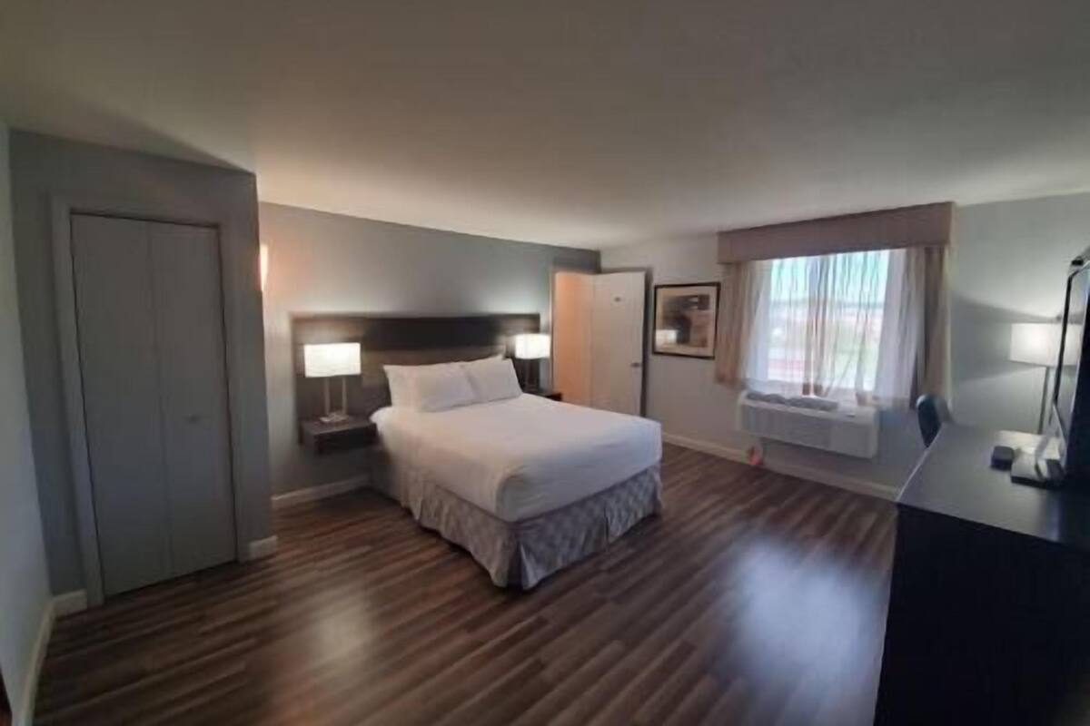 Pillow-top beds, laptop workspace, blackout curtains, iron/ironing board
