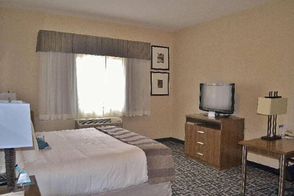 Pillowtop beds, laptop workspace, blackout drapes, iron/ironing board