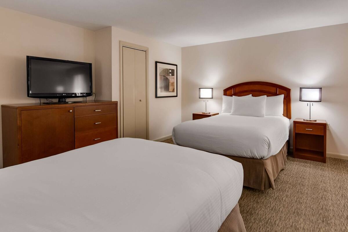 Pillow-top beds, laptop workspace, blackout curtains, iron/ironing board