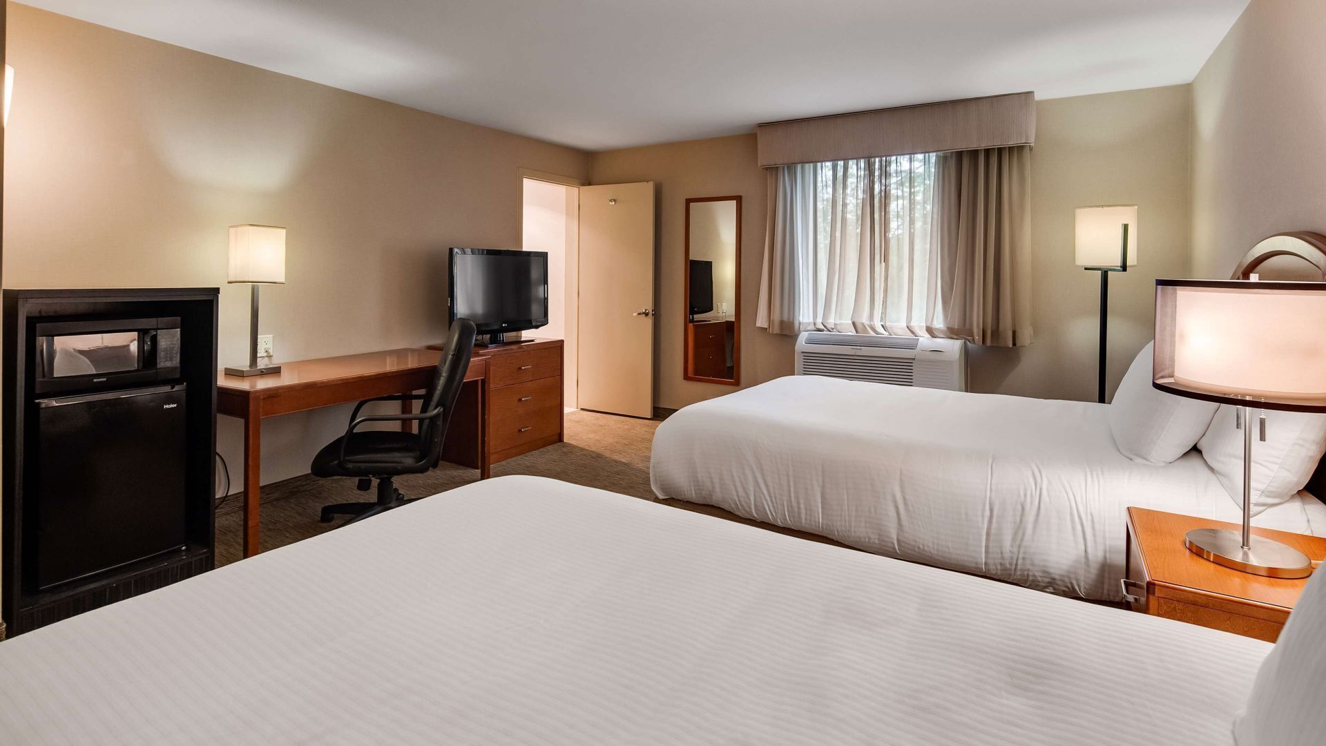 Pillow-top beds, laptop workspace, blackout curtains, iron/ironing board