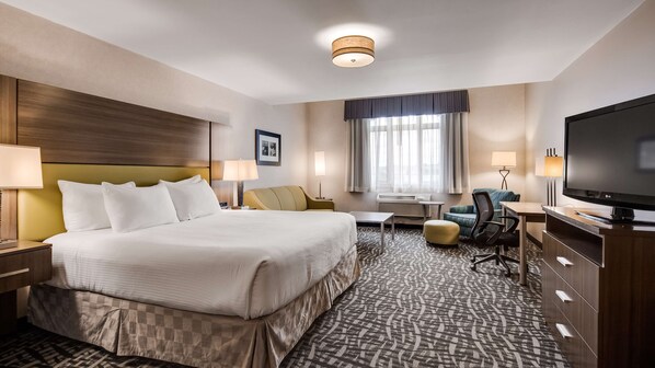 Suite, 1 King Bed, Non Smoking | Pillowtop beds, laptop workspace, blackout drapes, iron/ironing board