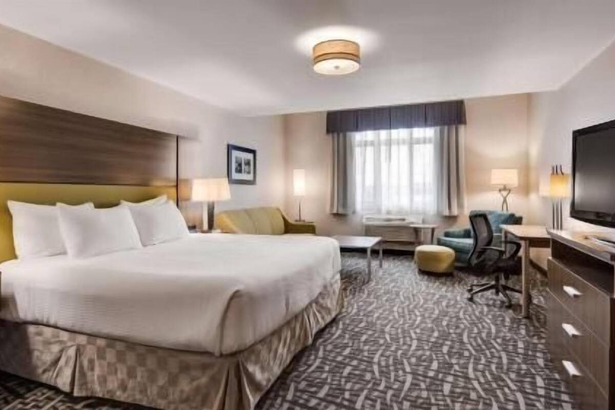 Pillow-top beds, laptop workspace, blackout curtains, iron/ironing board